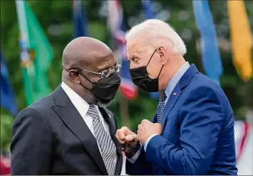  ?? Brendan Smialowski / AFP / TNS ?? Sen. Raphael Warnock of Georgia, another at-risk Democrat who appeared with President Joe Biden recently, said, “I really am focused on serving the people of Georgia.”