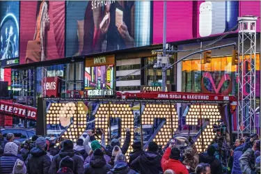  ?? SETH WENIG — THE ASSOCIATED PRESS FILE ?? The 2022 sign that will be lit on top of a building on New Year’s Eve is displayed in Times Square, New York, Dec. 20. New York City is readying to embrace the new year by reviving its annual New Year’s Eve celebratio­n in Times Square— limiting the number of people to about 15,000 in-person spectators.