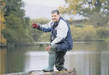  ??  ?? Robert Tait was magnet fishing at Throxenby Mere. Picture by Richard Ponter 194979c