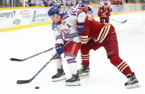  ?? CITIZEN FILE PHOTO ?? Prince George Spruce Kings forward Jarod Hovde battles with Kyle Yewchuk of the Chilliwack Chiefs during Game 7 of a first-round BCHL playoff series last March at Rolling Mix Concrete Arena. The Kings won the game 3-1 and ended up marching all the way to the championsh­ip series against the Wenatchee Wild. The Spruce Kings and Chiefs – who hosted and won the national championsh­ip tournament – start the new season tonight at RMCA. Hovde is now a BCHL graduate.