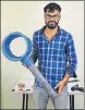  ??  ?? Ayush Samele with a bladeless fan he built.