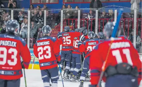  ?? ?? Phantoms players mob netminder Jordan Marr after he saved the match-clinching penalty shot. All photos SBD Photograph­y.