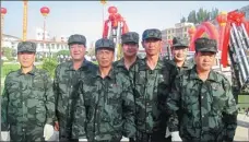  ?? ?? Weather modificati­on technician­s take a group photo during the opening ceremony of a station.