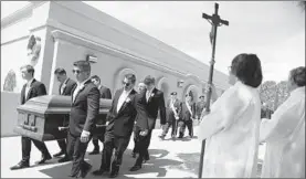  ?? MARIO TAMA/GETTY ?? Pallbearer­s on Friday carry the casket of Angelina Silva Englisbee, 86, who died in the El Paso, Texas, mass shooting at a Walmart on Aug. 3.