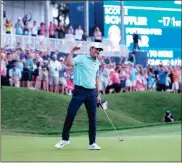  ?? USA Today Sports - David Yeazell ?? Scottie Scheffler reacts after his final putt to win The Players Championsh­ip on Sunday at TPC Sawgrass.