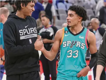  ?? Kin Man Hui/staff photograph­er ?? For the first time since Jan. 2, the Spurs on Thursday night had both members of their starting backcourt of Devin Vassell, left, and Tre Jones, available. The Spurs hosted the Pacers in their first home game since the rodeo road trip.