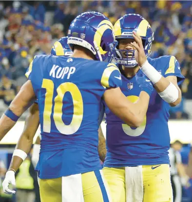  ?? GETTY FILE ?? WR Cooper Kupp and QB Matthew Stafford celebrate after a fourth-quarter TD against the 49ers in last season’s NFC title game.