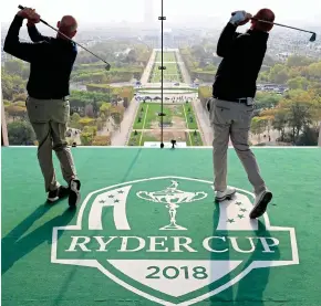  ?? GETTY ?? What an Eiffel: Furyk and Bjorn tee off from the iconic Paris tower