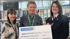  ??  ?? Loughborou­gh Building Society presented a cheque for £1,385 to Barrow Community Associatio­n. It was the first annual bonus payment as part of the Barrow Community Library Affinity savings account. Pictured left to right are: Angeline Kazianis, Keith...