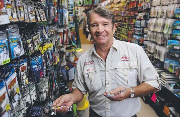  ?? Picture: MARC McCORMACK ?? RIGHT BAIT: Bransfords Tackle Shop owner Keith Graham at the Clifton Beach shop, which is about to launch a new website.