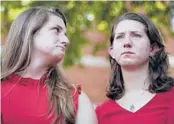  ?? JULIO CORTEZ/AP ?? Summerleig­h Geimer, left, and Montana Geimer, daughters of shooting victim Wendi Winters, react after the verdict in the trial of Jarrod Ramos on Thursday.