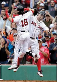  ?? AP/CHARLES KRUPA ?? Boston’s Andrew Benintendi
(Arkansas Razorbacks) celebrates with Xander Bogaerts (right) after hitting a two-run home run in the fifth inning that put the Boston Red Sox ahead 3-2. Houston would rally to win 5-4 and win the American League division...