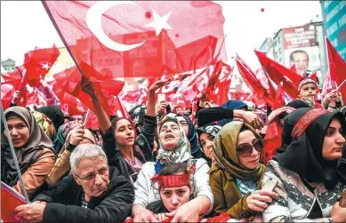  ?? OZAN KOSE / AFP ?? People cheer during a rally in support of Turkish President Recep Tayyip Erdogan on Sunday in Istanbul. Erdogan lashed out again in the diplomatic row with the European Union saying it would be “easier” if the EU just rejected Turkey’s bid to join the...