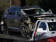  ?? ASHLEY LANDIS ?? A vehicle is towed away from the site of a crash involving golfer Tiger Woods, Tuesday, Feb. 23, 2021, in the Rancho Palos Verdes suburb of Los Angeles.