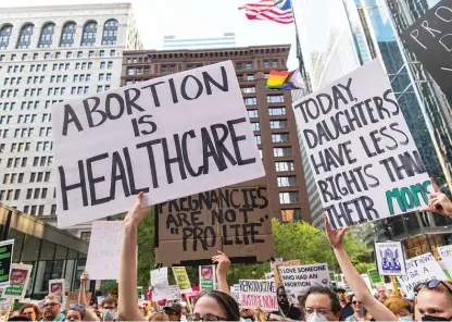  ?? TYLER PASCIAK LARIVIERE/SUN-TIMES ?? Protesters march in downtown Chicago on Friday after the Supreme Court overturned Roe v. Wade.