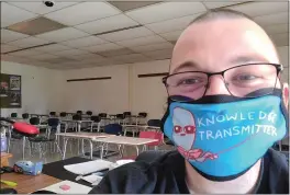  ?? THE ASSOCIATED PRESS ?? Bill Mathis of Romeo, Mich., in one of the rooms where he taught high school English. Stress over teaching during a pandemic put Mathis, 29, over the edge, and he resigned in November 2020.