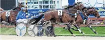  ?? PHOTO: THE DIGITAL BIRDCAGE ?? Trial ticked off . . . Spankem (outer) and driver Mark Purdon win the New Zealand Cup Trial at Addington Raceway yesterday over stablemate Thefixer and Natalie Rasmussen (inner), with A G’s White Socks third.