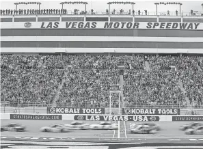  ?? STEPHEN R. SYLVANIE/USA TODAY SPORTS ?? Cars speed past the start-finish line at Las Vegas Motor Speedway in 2016.