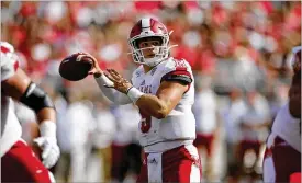  ?? JAY LAPRETE / AP ?? Miami University quarterbac­k Brett Gabbert threw for a career-high 492 yards and five touchdowns Tuesday night in a 35-33 loss to the Ohio Bobcats.