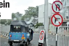  ??  ?? Road rules are meant for breaking appears to be the motto of these three wheelers. Pix by Priyantha Wickramaar­achchi