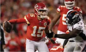  ?? Photograph: Charlie Riedel/AP ?? Kansas City Chiefs quarterbac­k Patrick Mahomes (15) runs with the ball as Denver Broncos defensive tackle Shamar Stephen defends during Saturday’s first half.