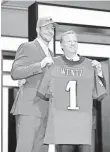  ?? KAMIL KRZACZYNSK­I, USA TODAY SPORTS ?? Carson Wentz poses with Commission­er Roger Goodell after being drafted No. 2.