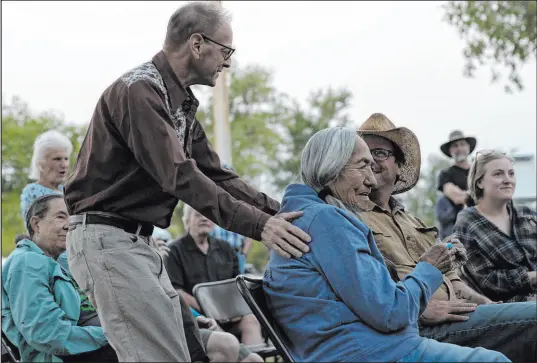  ?? Ellen Schmidt
Las Vegas Review-journal @ellenschmi­dttt ?? Simeon Herskovits, a lawyer who once fought against a water pipeline into Southern Nevada from eastern Nevada, squeezes the shoulders of Delaine Spilsbury, an Ely Shoshone tribal leader, at a Sept. 9 celebratio­n of the proposal’s defeat held in Baker, Nev.