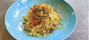  ??  ?? Crab roe spaghettin­i.