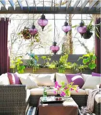  ??  ?? a narrow 4m by 2.5m outdoor space was turned into a full-fledged living room by adding a pergola for shade and suspending outdoor pendant lights, privatizin­g the area with a planter wall, using a ushaped sectional for seating up to seven, and creating...