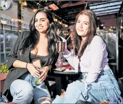  ??  ?? FLEX AND THE CITY: Juliana Mora (left) and Olivia Brewer are both in the process of getting vaccinated and are gearing up for a wild “hot girl summer” after months of staying home. “I think my goal is to go out all the time,” Brewer, 23, told The Post, while recently having drinks at the Red Lion in the Village.