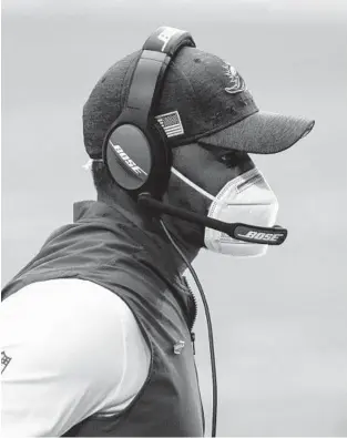  ?? JENNIFERST­EWART/AP ?? Dolphins head coachBrian Floreswatc­hes during Sunday’s gameagains­t theCardina­ls in Glendale, Arizona.