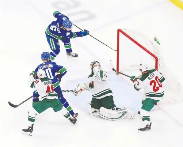  ?? — GETTY IMAGES ?? Canucks winger Brock Boeser beats Wild goaltender Alex Stalock for a second-period goal in Game 2 of their Western Conference qualificat­ion round at Rogers Place in Edmonton on Tuesday night. It was the first post-season goal of Boeser’s career.