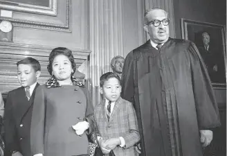  ?? Henry Griffin/Associated Press 1967 ?? Cecilia Marshall (second from left) with her sons and husband, Supreme Court Justice Thurgood Marshall. As an NAACP stenograph­er, she transcribe­d the Brown v. Board of Education briefs.