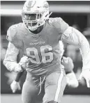  ?? MICHAEL AINSWORTH/AP ?? Dolphins defensive end Taco Charlton leads the team in sacks with four.