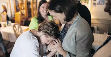  ?? NICK KOZAK FOR POSTMEDIA NEWS ?? Rose Lipszyc, left, and Janina Zak-Krasucki embracing at a reunion of families at Rose’s home in Toronto. Lipszyc, 89, was shepherded to safety by Zak-Krasucki’s Polish Catholic grandparen­ts during the Holocaust.