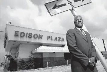  ?? C.W. GRIFFIN Miami Herald file ?? In this photo from May 12, 2005, Otis Pitts Jr. stands before the Edison Plaza area of Miami, an area he helped revitalize by bringing in a new mall.