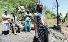  ?? Pictures: JACKIE CLAUSEN ?? DOWN IN THE DUMPS: Waste pickers Walani Radebe, Mzwandile Linda, Tsele Msiya and Hamilton Ngcobo live in the bush near the Shongweni landfill site