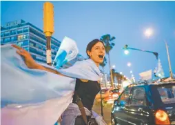  ?? AP//MATILDE CAMPODONIC­O ?? Supporters of Luis Lacalle Pou celebrate in Montevideo after his rival in the presidenti­al race conceded.