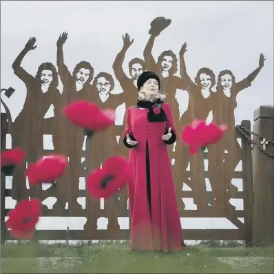  ?? PICTURE: PA ?? MUSICAL PROJECT: Singer Fiona Kennedy promotes # iSing4Peac­e at the Land Army War Memorial at Clochan, Moray.