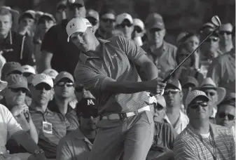  ?? ASSOCIATED PRESS ?? Jordan Spieth hits out of the gallery on the 18th hole during the third round of the Masters golf tournament in Augusta, Ga.