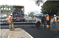  ?? ?? A contractor resurfaces King George Road at the Avondale Shopping Centre in Harare as part of the Government’s massive road rehabilita­tion programme and in line with the sprucing up of the city ahead of the SADC summit in August