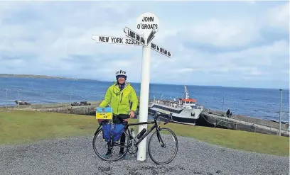  ?? ?? Fantastic achievemen­t
Andy reaches John O’ Groats after his epic cycle from Land’s End