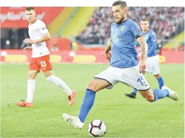  ??  ?? Italy’s defender Cristiano Biraghi kicks the ball during the UEFA Nations League football match Poland v Italy at the Silesian Stadium in Chorzow, Poland. — AFP photo