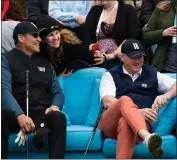  ?? MOLLY GIBBS - MONTEREY HERALD ?? Ron Rivera, head coach of the NFL Washington Commanders (left), and Brian Ferris, co-chairman of Pebble Beach Co. (right), relax and pose for photos at Club 15.