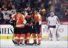  ?? DERIK HAMILTON — THE ASSOCIATED PRESS ?? From left, the Philadelph­ia Flyers’ Valtteri Filppula, Radko Gudas, Travis Konecny, Wayne Simmonds and Robert Hagg celebrate after Simmonds scored a goal during the third period of an NHL game against Washington Capitals’ goalie Philipp Grubauer,...