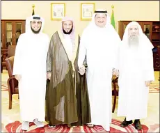  ?? KUNA photos ?? Acting Speaker Al-Kanderi receiving Saudi religious scholar Sheikh Ayed
Al-Qarni.