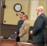  ?? NICHOLAS BUONANNO -- NBUONANNO@TROYRECORD.COM ?? Christophe­r Neumann, far left, stands next to his attorney, James Long, as Rensselaer County District Attorney Joel Abelove looks on during Neumann’s sentencing.