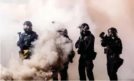  ?? Photograph: Noah Berger/AP ?? Federal officers use chemical irritants and projectile­s to disperse Black Lives Matter protesters on 24 July 2020, in Portland.