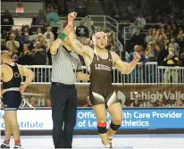  ?? JANE THERESE/SPECIAL TO THE MORNING CALL ?? Lehigh’s Michael Beard celebrates his victory over Penn State’s Max Dean at 197 pounds on Sunday at Stabler Arena in Bethlehem. No. 1 Penn State defeated Lehigh 24-12.