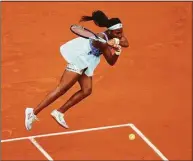  ?? Adam Pretty / Getty Images ?? Coco Gauff plays a backhand against Sloane Stephens during their quarterfin­al match at the French Open on Tuesday.